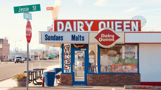 a dairy queen in a small town with a flat roof, not a modern dairy queen